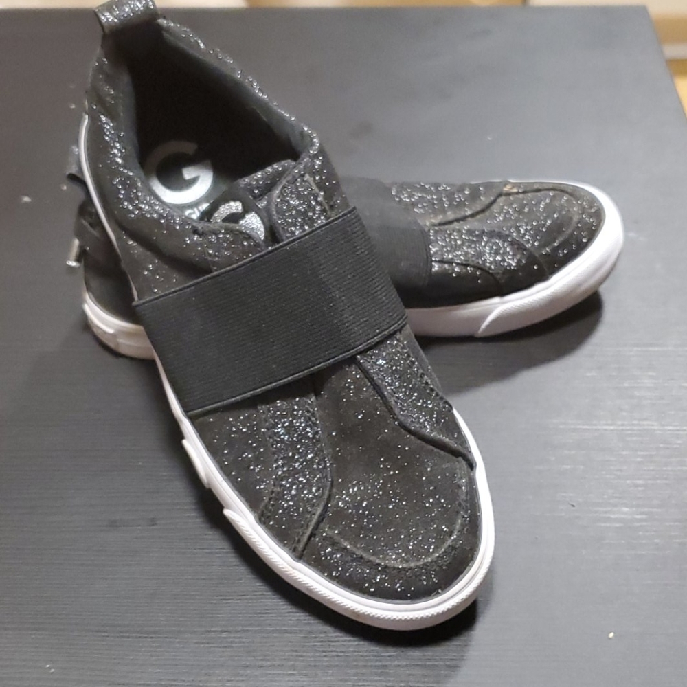 Black guess slip ons